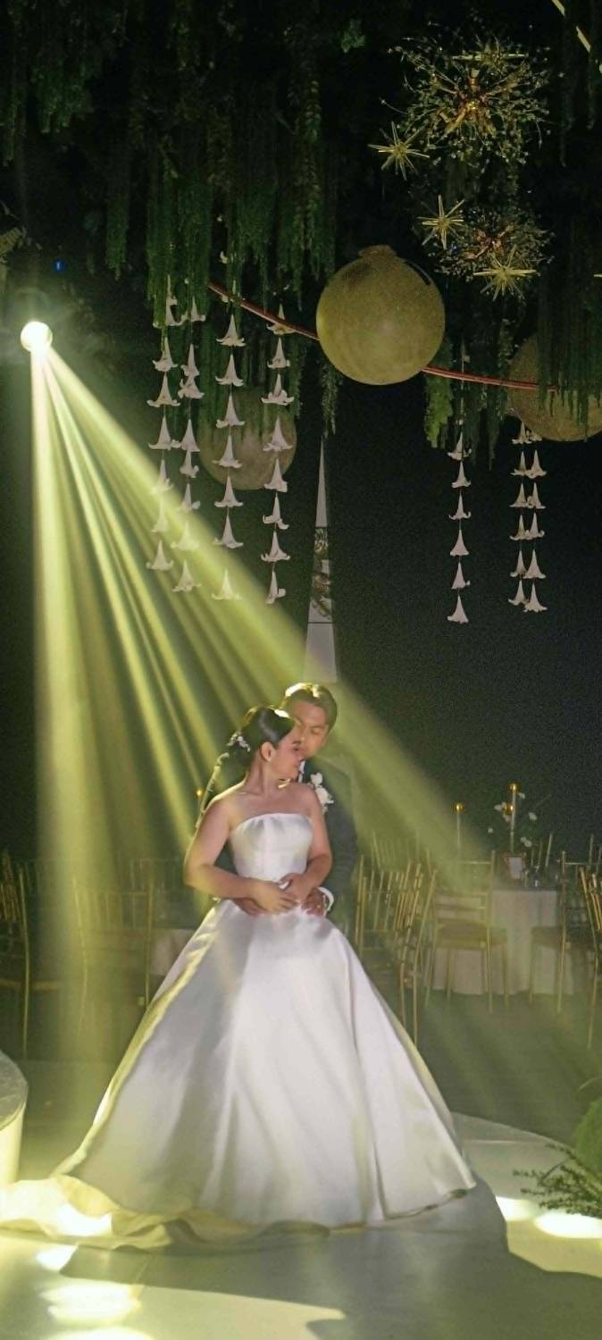 Couple's first dance under a spotlight